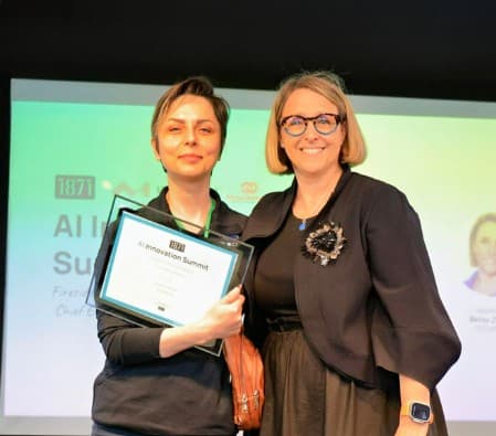 Ex.Brain accepting the 1871 Judges' Choice Award at the 2024 AI Innovation Summit